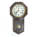 An early 20th century Ansonia drop dial wall clock, with Roman numeral dial, with pendulum, a/f,