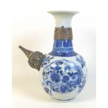 A Chinese porcelain pouring vessel 'kendi' vase, Qing Dynasty, 18th century, with flared rim on a