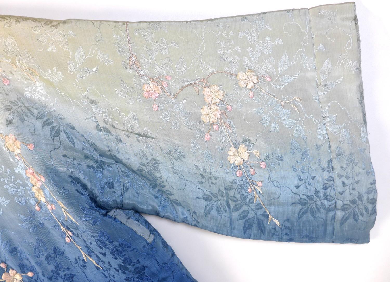 An early 20th century Japanese haori padded jacket, embroidered in silk with white and pink flowered - Image 17 of 17