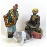 Two Royal Doulton figurines, 'Mendicant' H.N. 1365, 'Carpet Seller' H.N. 1464, together with a