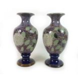 A near pair of Royal Doulton stoneware 'Roses' pattern vases, of baluster form, with rose decoration