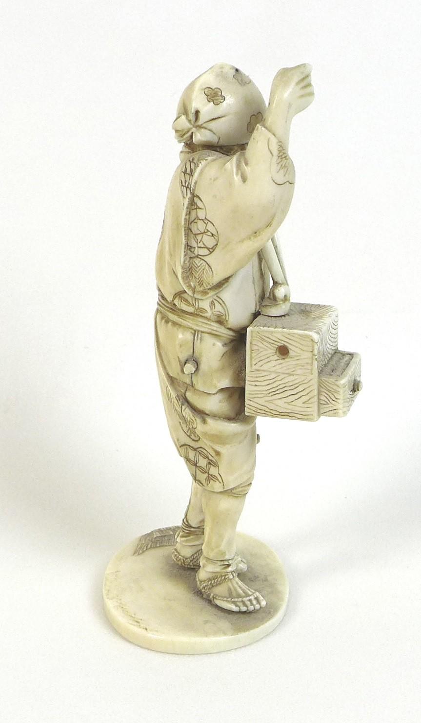 A Japanese ivory okimono, Meiji Period, late 19th century, modelled as a man standing looking up - Image 3 of 6