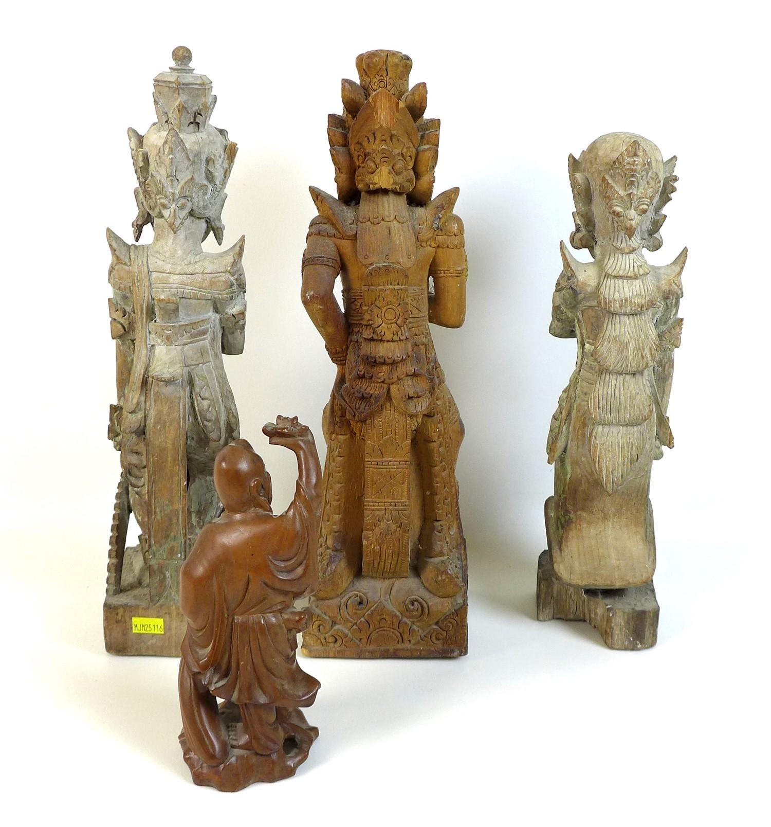 A group of four wooden carvings, comprising a Chinese carving of a man holding a flower aloft, 20cm, - Image 2 of 2