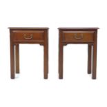 A pair of late 20th century mahogany bedside tables, each with a single drawer and brass handle,