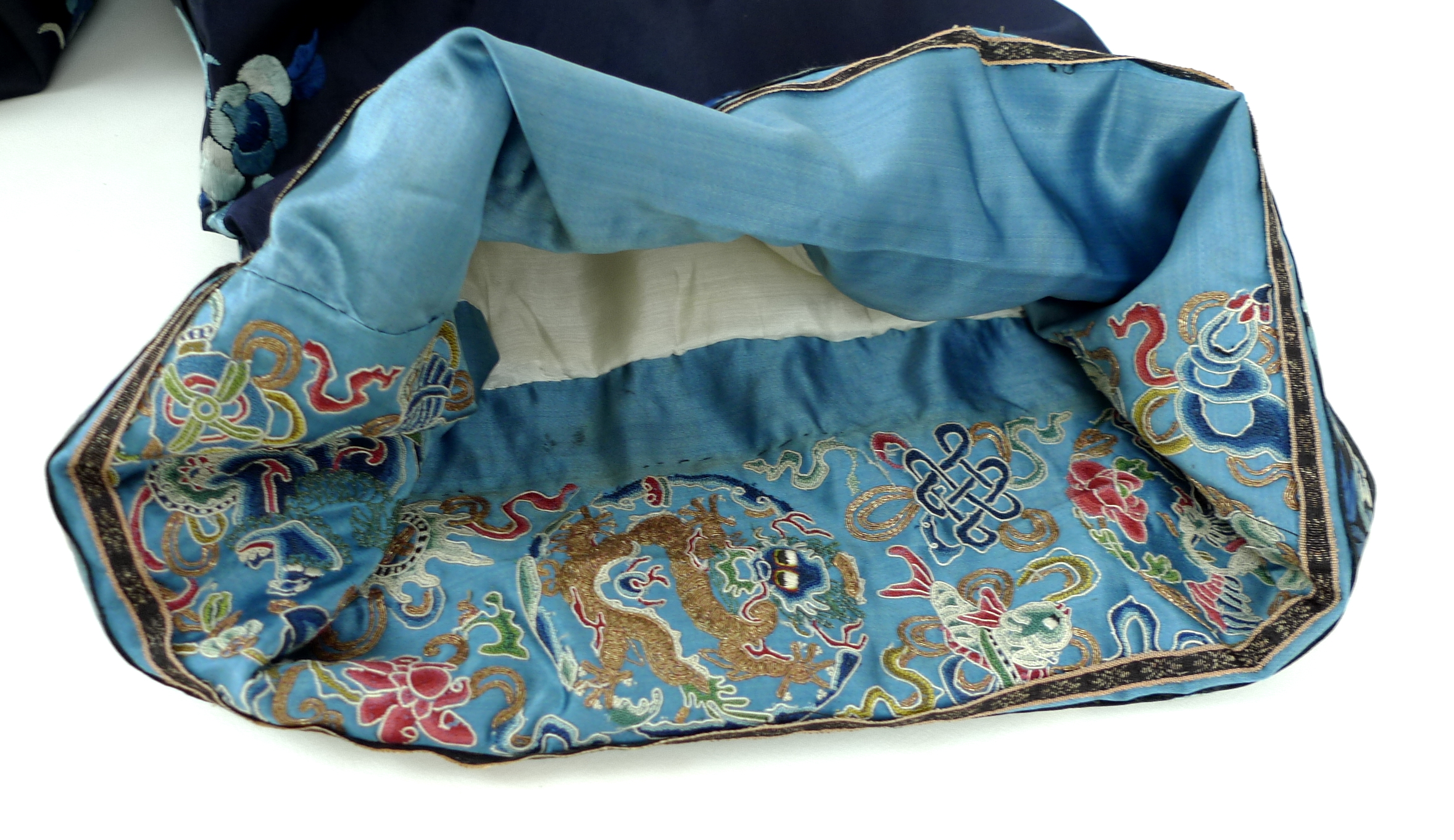 An early 20th century silk Chinese robe, with navy blue ground and intricately embroidered with - Image 21 of 34