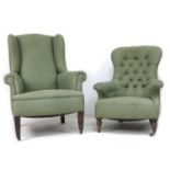 A mid 20th century wing back armchair, with tapered legs, upholstered in green diamond patterned