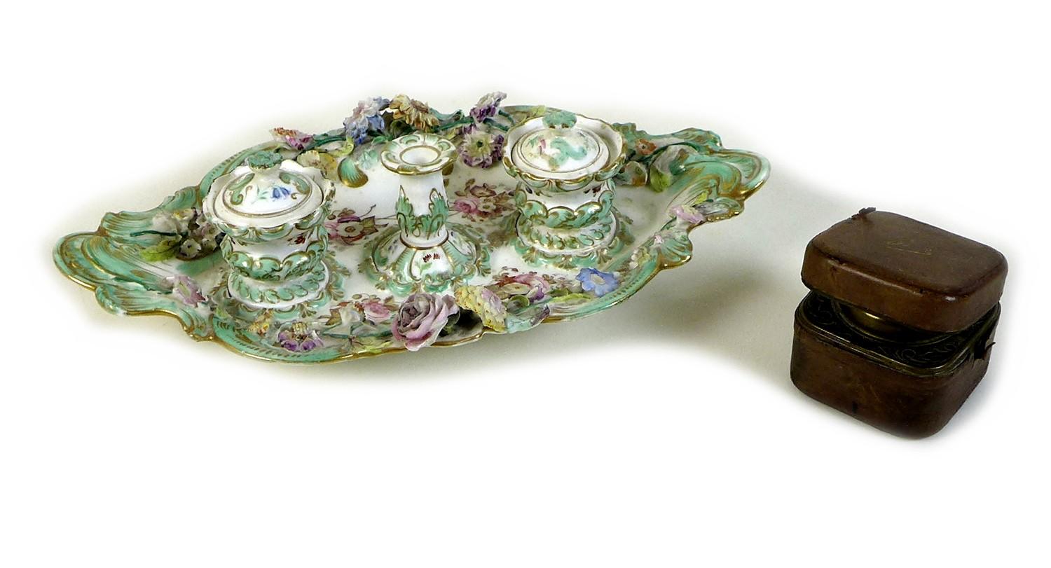 A Continental porcelain desk stand, 19th century, in rococo taste with applied and painted