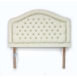 A modern bed headboard, recently upholstered in buttoned cream foliate cotton, 155 by 12 by 147cm