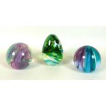 A group of three Caithness paperweights, comprising Colour Pool, Aries, and Scimitar, each with