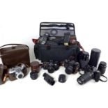 A collection of four cameras and accessories, including three Asahi Pentax cameras, an S1a with