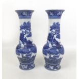 A pair of Edwardian Wedgwood vases, of baluster form with long necks, transfer printed in 'Fallow