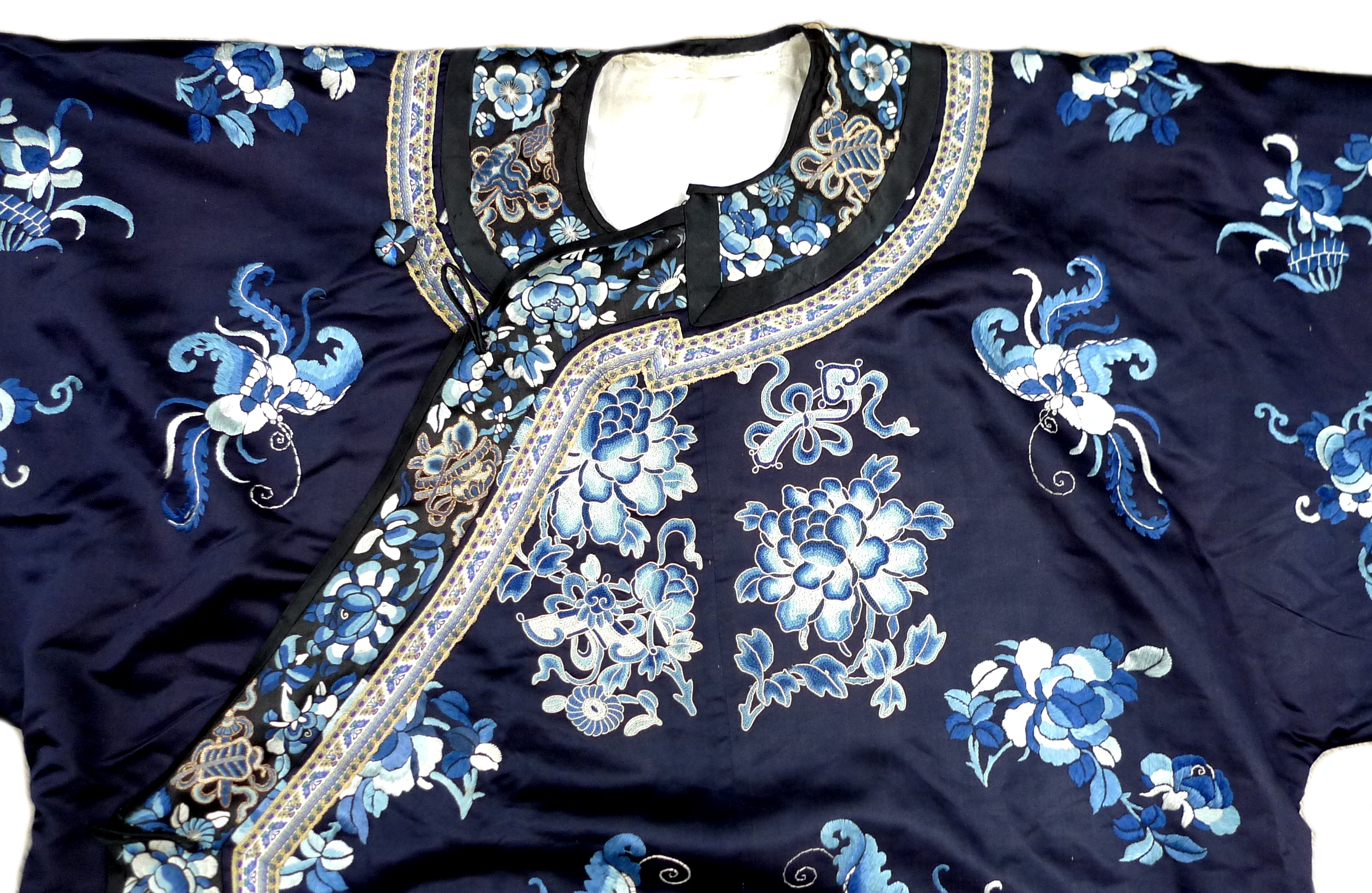 An early 20th century silk Chinese robe, with navy blue ground and intricately embroidered with - Image 8 of 34