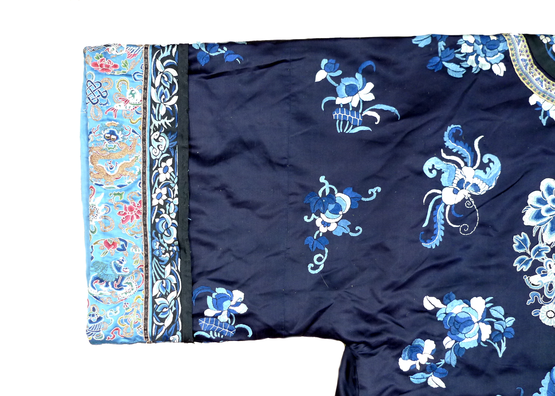 An early 20th century silk Chinese robe, with navy blue ground and intricately embroidered with - Image 32 of 34