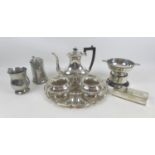 A group of six silver plated items, comprising a three piece tea service, a lidded box, a tray