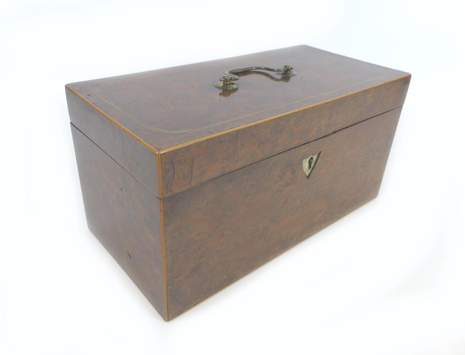 A 19th century burr walnut tea caddy, with boxwood inlays, its interior with attached note '..from