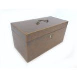 A 19th century burr walnut tea caddy, with boxwood inlays, its interior with attached note '..from