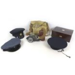 A WWII Mk 4 gas mask bearing '1940' an associated cloth case, three military caps, and a Victorian