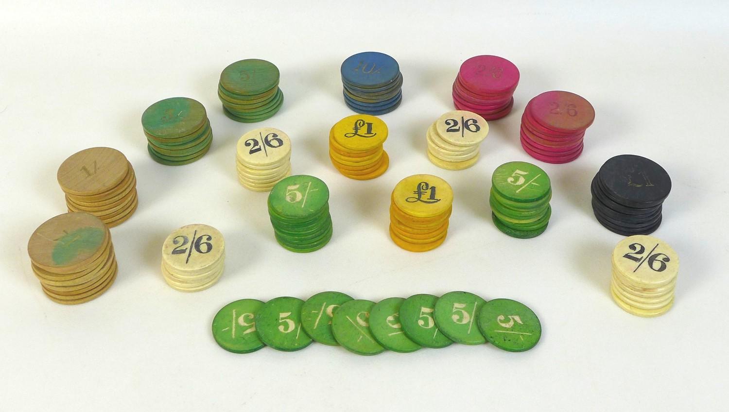 A collection of stained wooden and bone gaming chips / counters, for poker, cards, etc.,