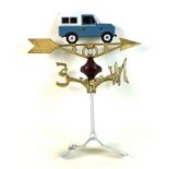 A modern cast iron weather vane, painted metal, with Land Rover Defender shaped ornament, and gold