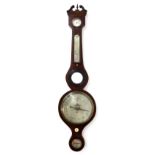 A Victorian mahogany wheel barometer, with boxwood and ebony strung inlays, silvered dial, with