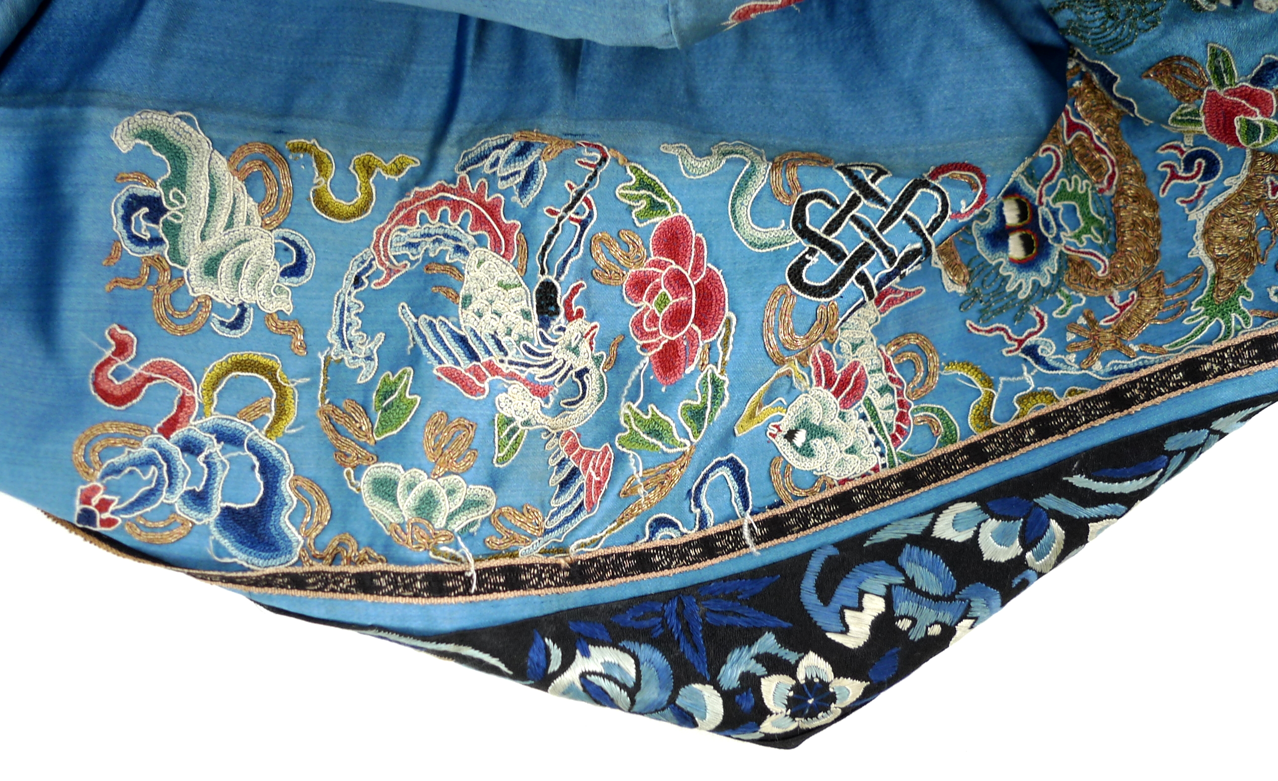 An early 20th century silk Chinese robe, with navy blue ground and intricately embroidered with - Image 17 of 34