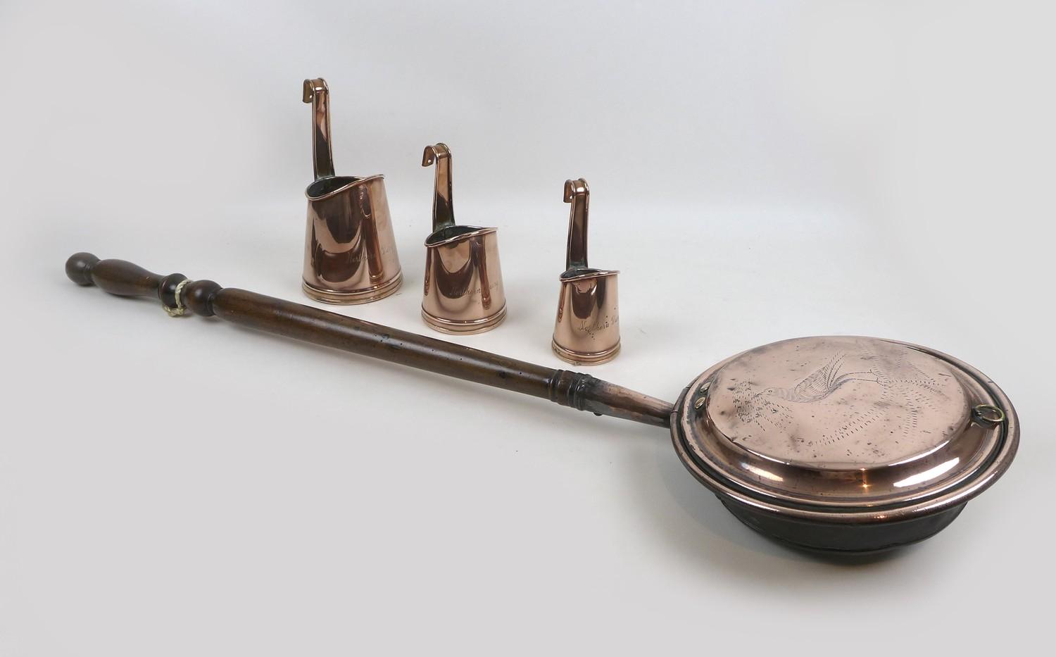 Three copper graduated Northern Dairy milk measures, largest 12cm diameter, 23.5cm high, smallest