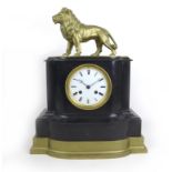 A 19th century French black slate mantel clock, with gilt lion surmount, Roman numeral enamel