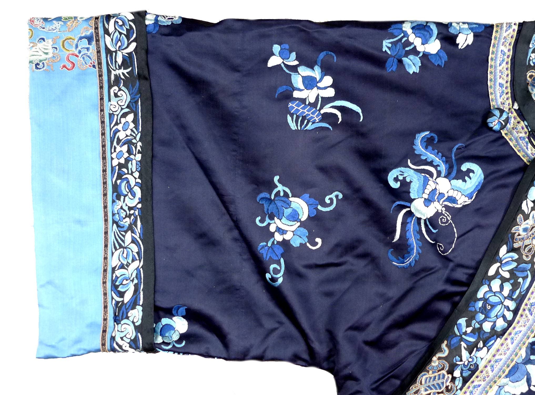 An early 20th century silk Chinese robe, with navy blue ground and intricately embroidered with - Image 14 of 34