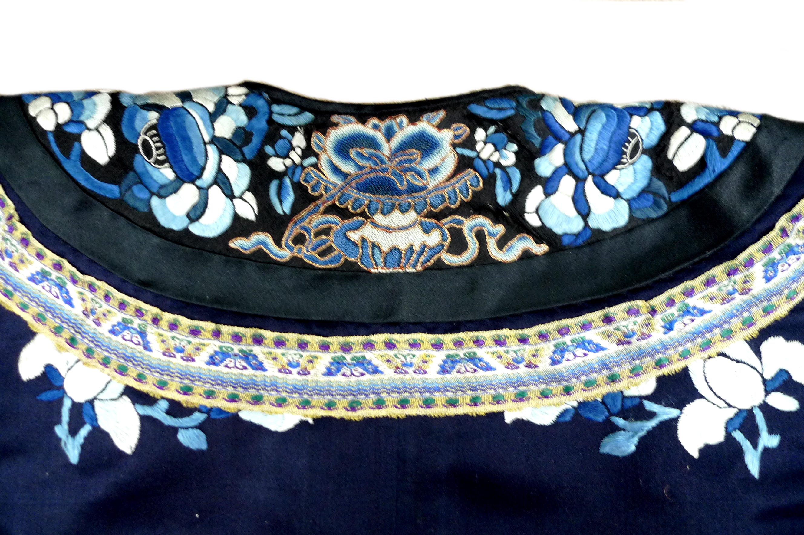 An early 20th century silk Chinese robe, with navy blue ground and intricately embroidered with - Image 28 of 34