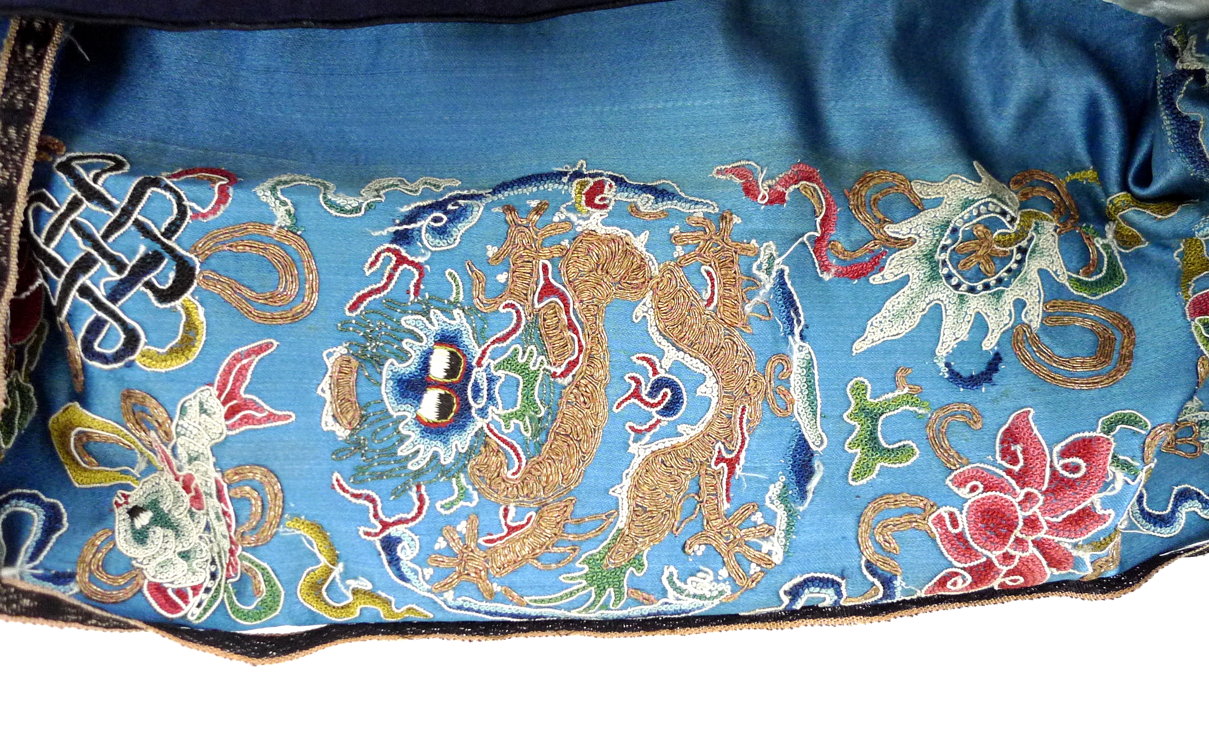 An early 20th century silk Chinese robe, with navy blue ground and intricately embroidered with - Image 18 of 34