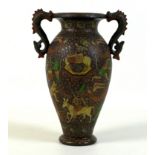 A Kashmiri papier maché vase, early 20th century, of baluster form with twin dragon handles,
