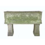 An early 20th century carved stone garden planter, of open coffin form with two drainage holes,