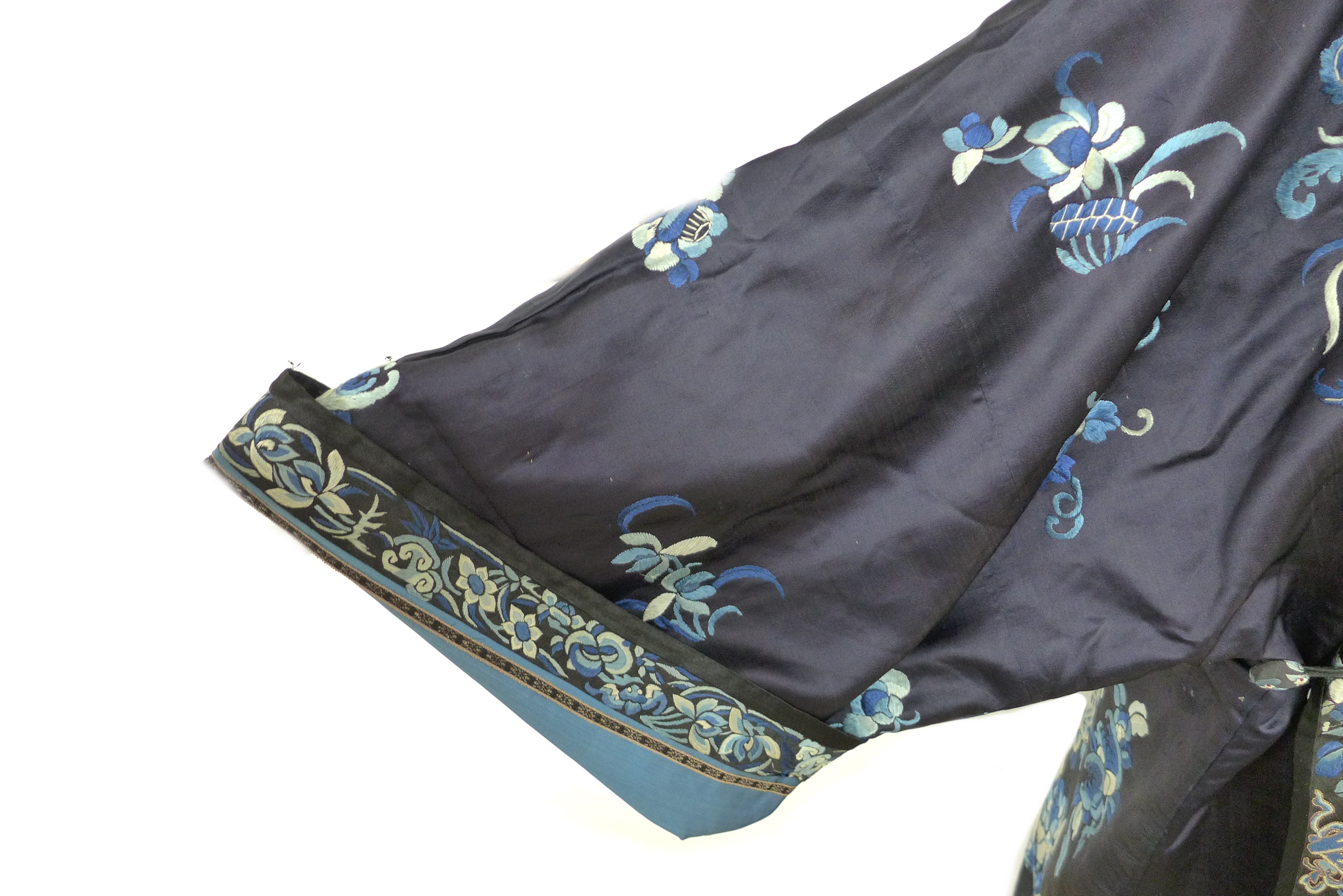 An early 20th century silk Chinese robe, with navy blue ground and intricately embroidered with - Image 15 of 34