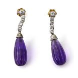 A pair of platinum, diamond, and amethyst drop earrings, with a row of five brilliant cut stones,