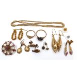 A group of 9ct gold and yellow metal jewellery, including a ruby set brooch, a ring set with blue