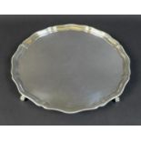A George VI silver tray, with chippendale rim, raised upon four claw and ball feet, 2.8 by 30cm,