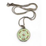 A Continental guilloche enamel and white metal pendant locket, of circular form decorated with