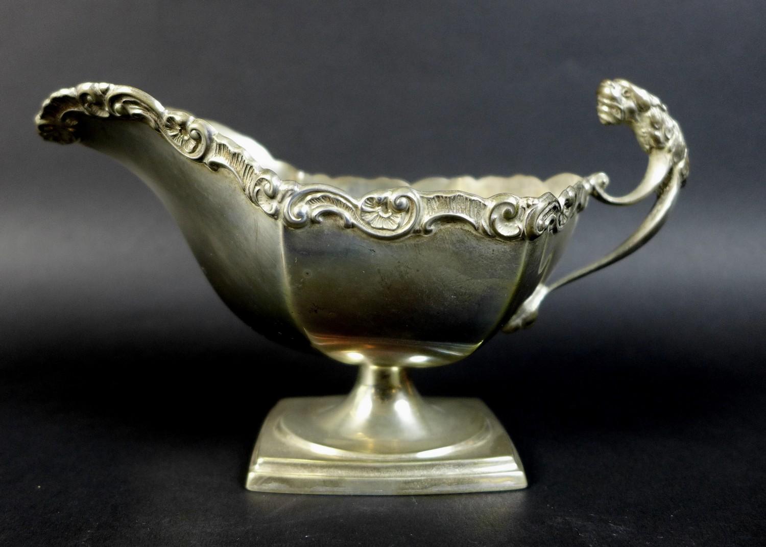 A pair of Edwardian silver sauce boats, the handles with cast jaguar heads, and scroll rim, raised - Image 4 of 15