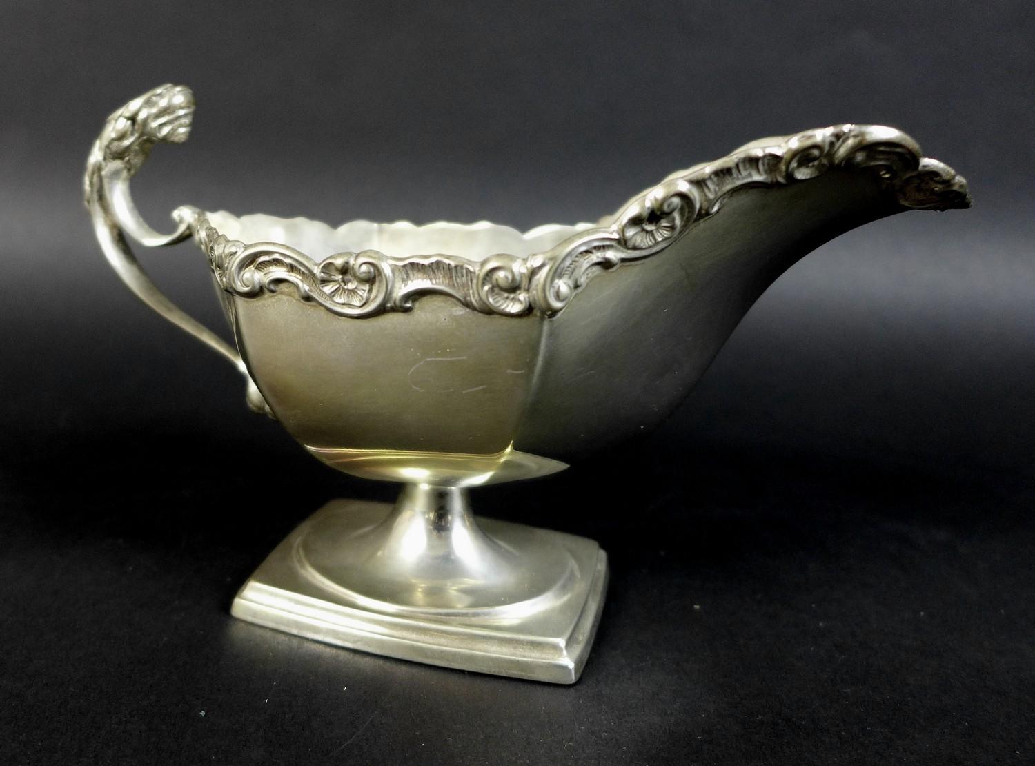 A pair of Edwardian silver sauce boats, the handles with cast jaguar heads, and scroll rim, raised - Image 3 of 15
