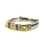 An unusual jointed 18ct gold and diamond ring, formed of eleven separate parts with flexible joints,