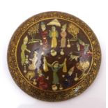 A vintage Kashmiri painted circular brooch, depicting a joyful gathering with hunting and dancing,