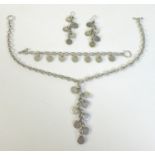 A set of designer silver jewellery, comprising a pair of earrings, bracelet and necklace, of