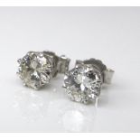 A pair of diamond and 18ct white gold stud earrings, each of approximately 0.5ct, 1.8g.