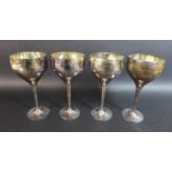 Two pairs of Culinary Concepts silver plated wine goblets, with planished effect decoration, each