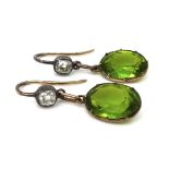 A pair of Edwardian peridot and diamond drop earrings, the rounded rectangular cut diamonds, each