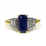 An Art Deco style 18ct gold, sapphire and diamond ring, with raised platinum setting, the central