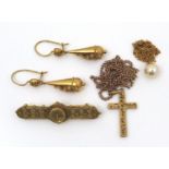 A group of gold jewellery, comprising a late Victorian bar brooch cast with leaf and scroll