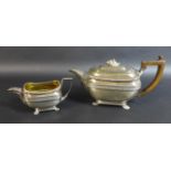 A George III silver teapot and matching milk jug, of London shape with basket weave and stiff leaf