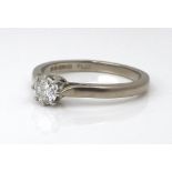 A platinum, white gold and diamond solitaire ring, the diamond of approximately 0.25ct, size M, 3.