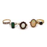 A group of five gold rings, comprising a 9ct yellow gold opal and garnet flowerhead ring, the 10